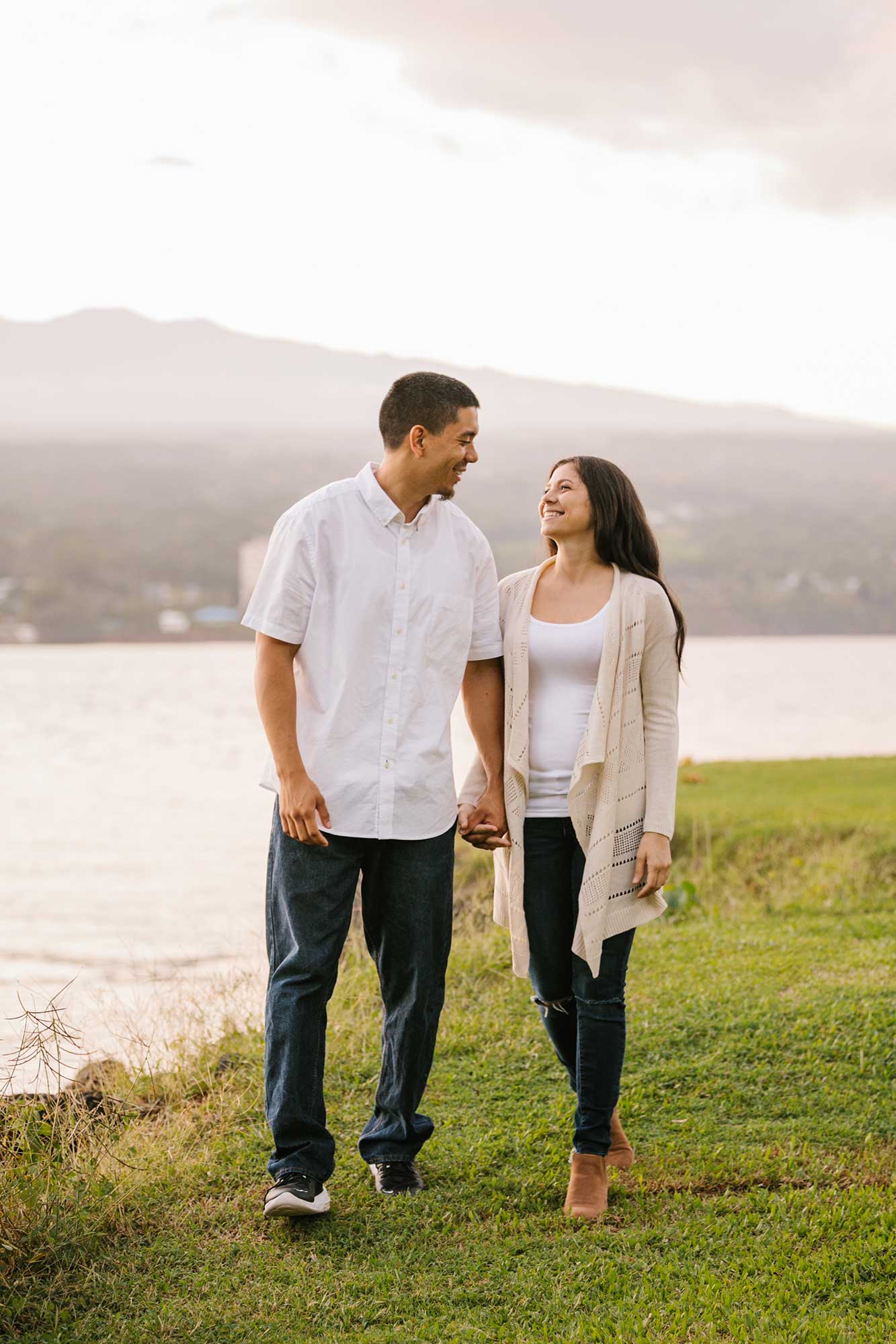 image of couple walking in the grass