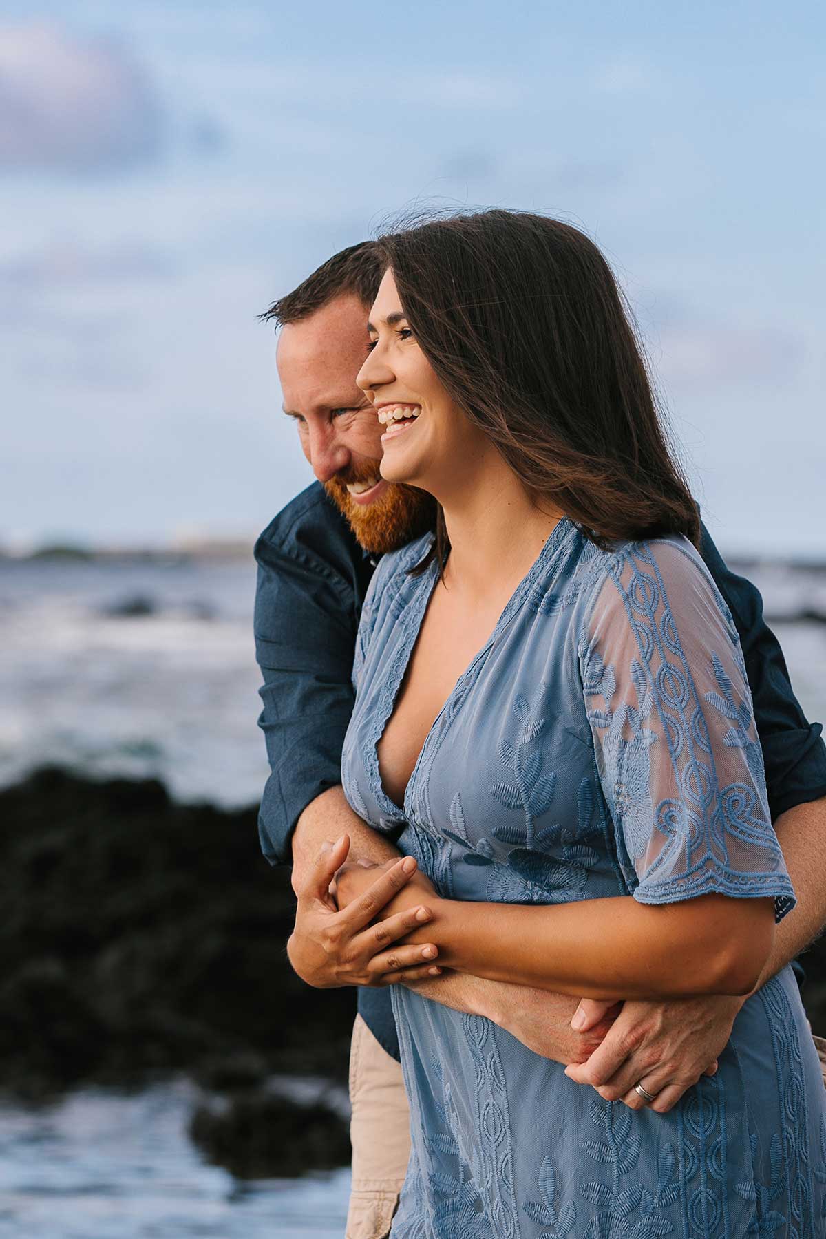 image of couple hugging on the beach