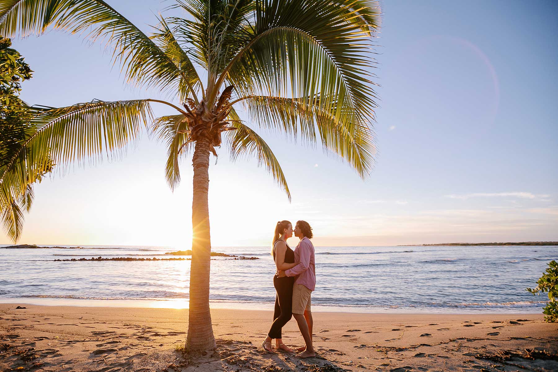 image of couple holding each other on the beach