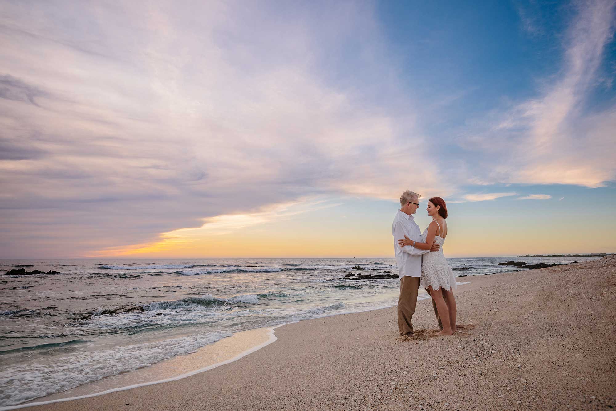 image of couple on the beach