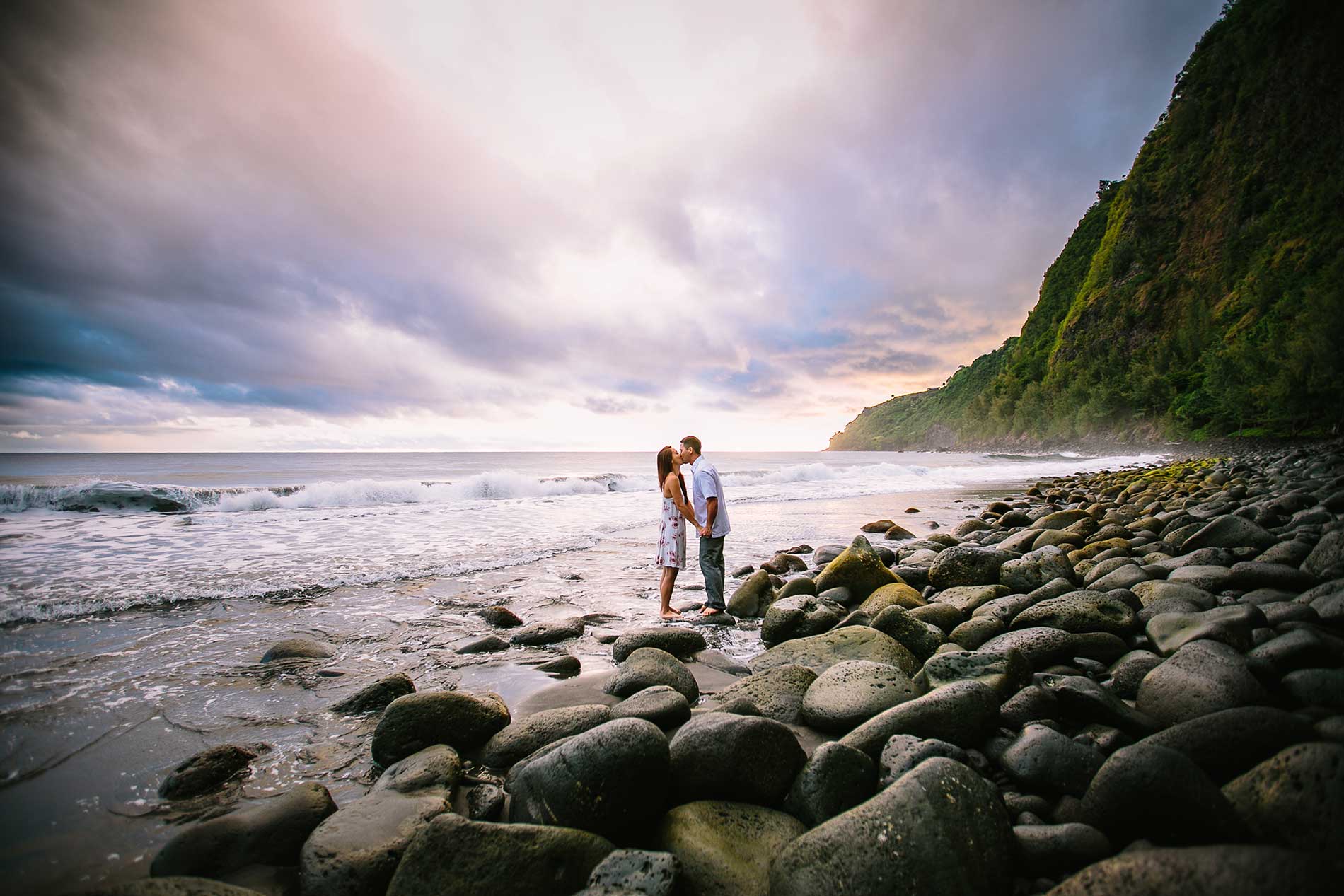 image of couple on rocks near a beach