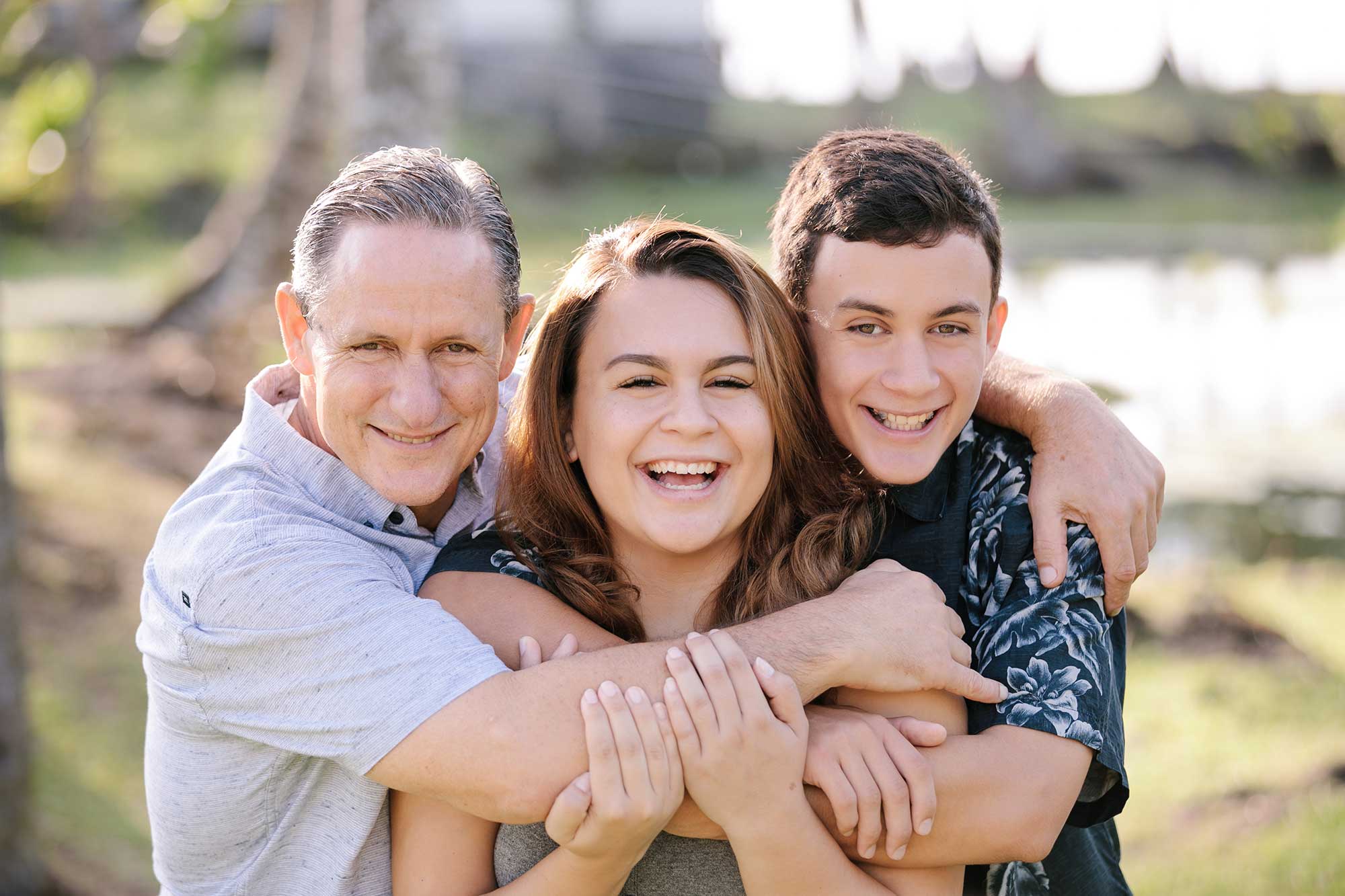 image of couple and their son at the beach