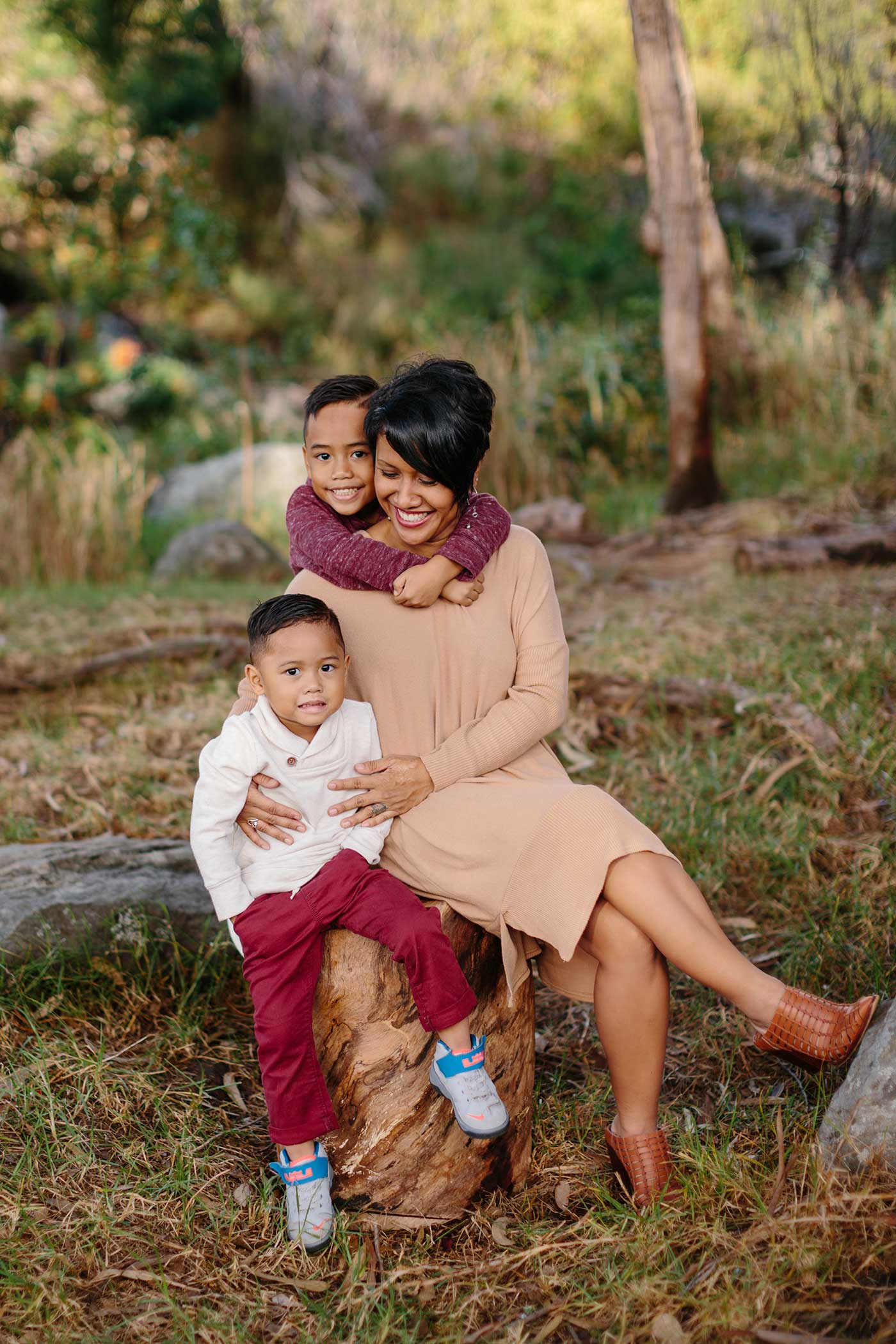 image of pretty mother and her kids in the forest