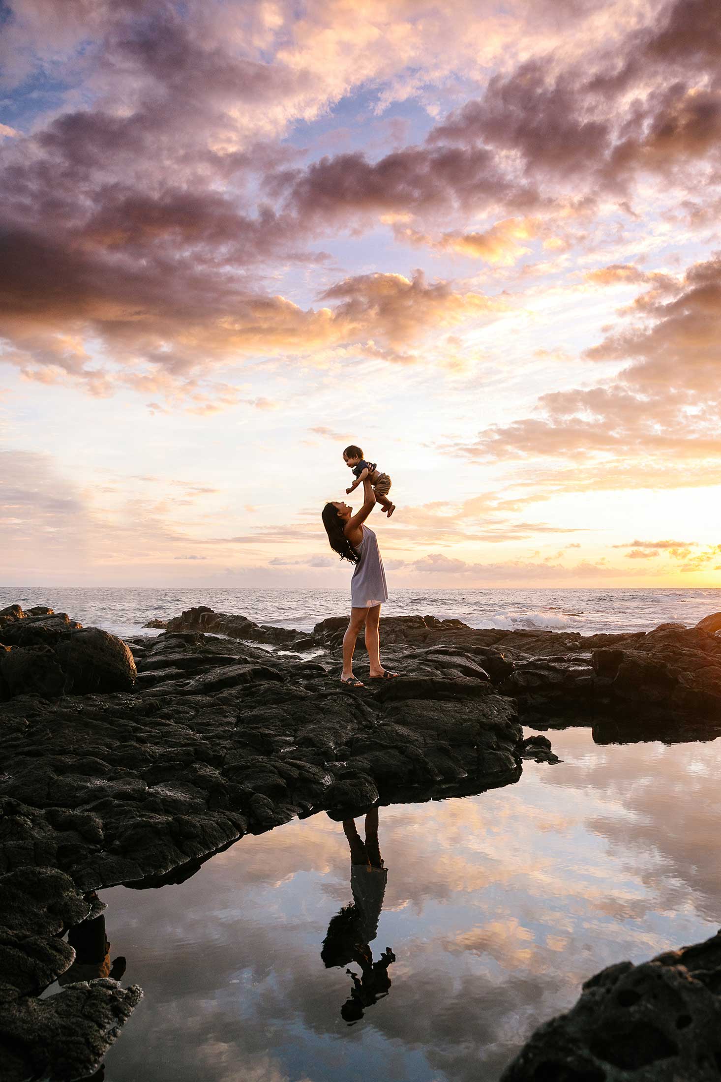image of mother and son at the beach during sunset