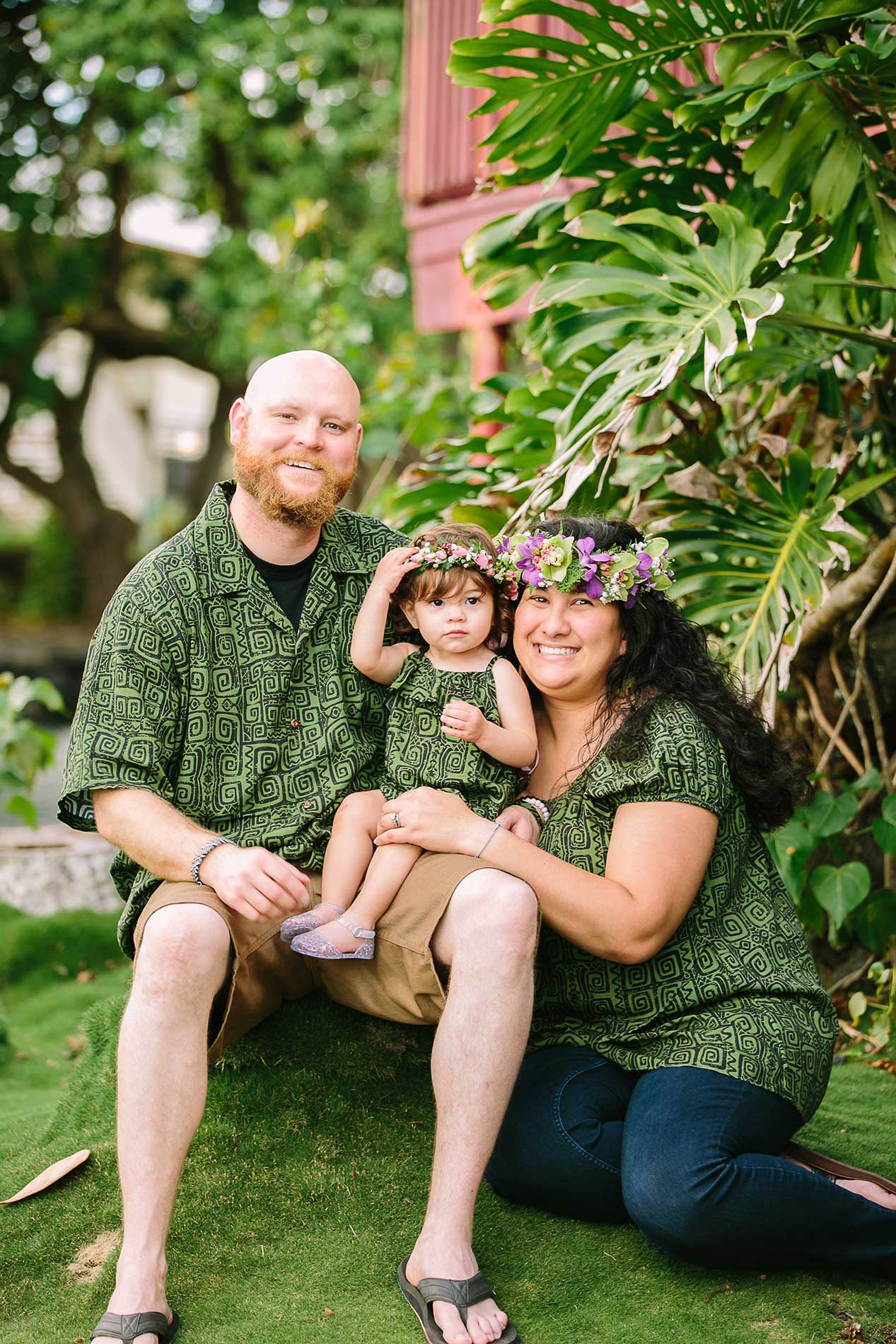 image of couple with their child at the park