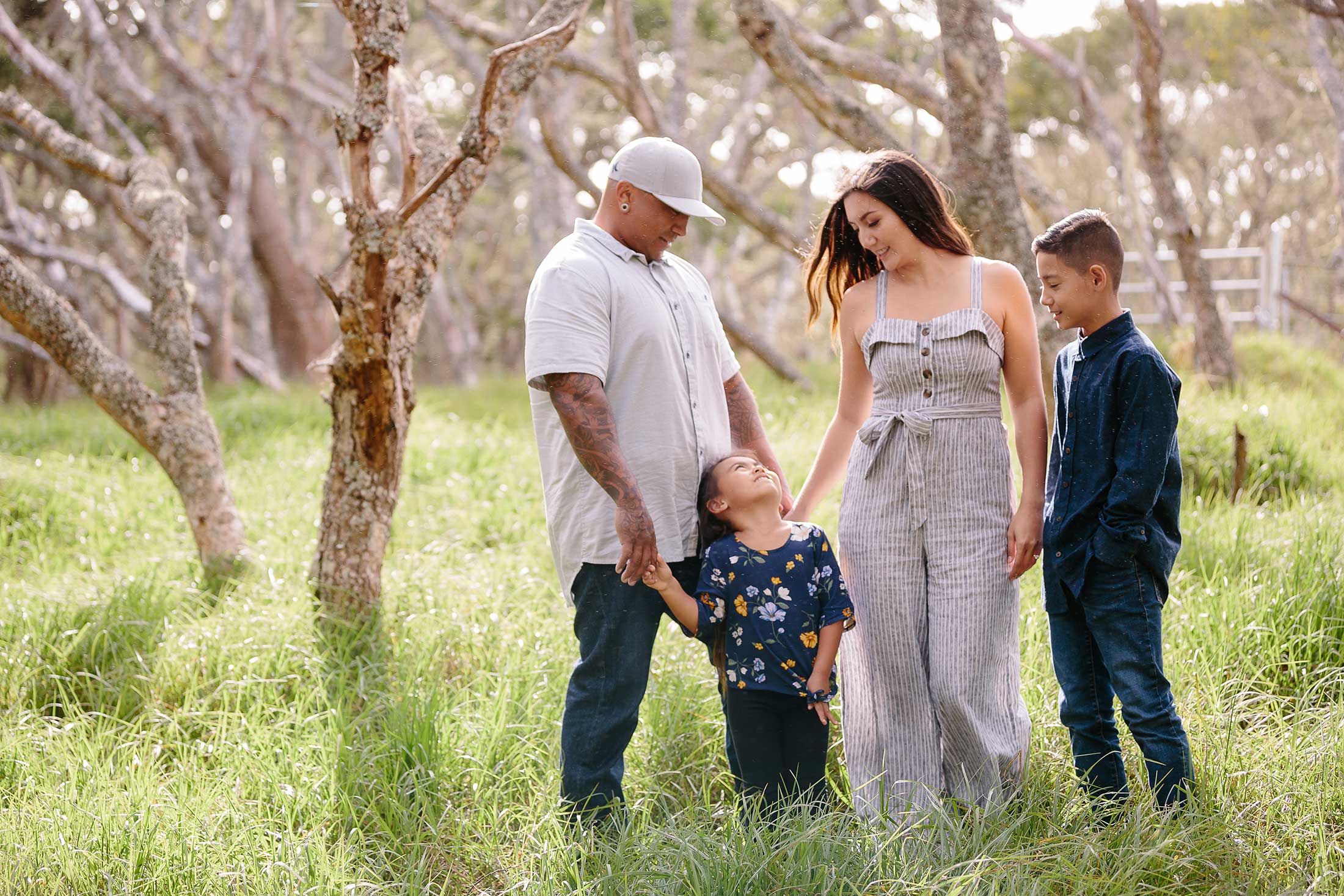 image of couple with their 2 kids in the forest