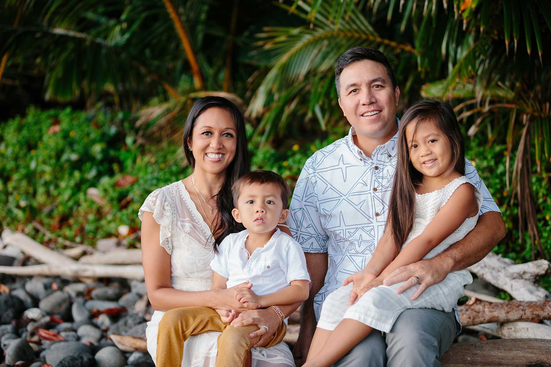 image of couple near the beach with their 2 kids