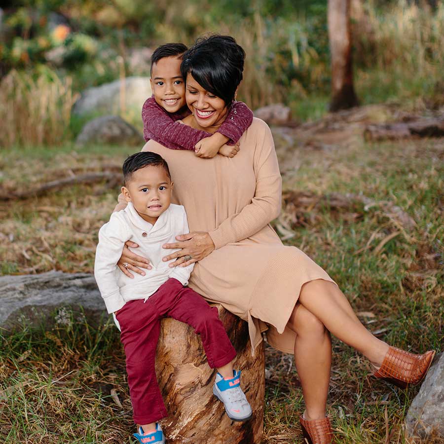 image of pretty mother and her kids in the forest