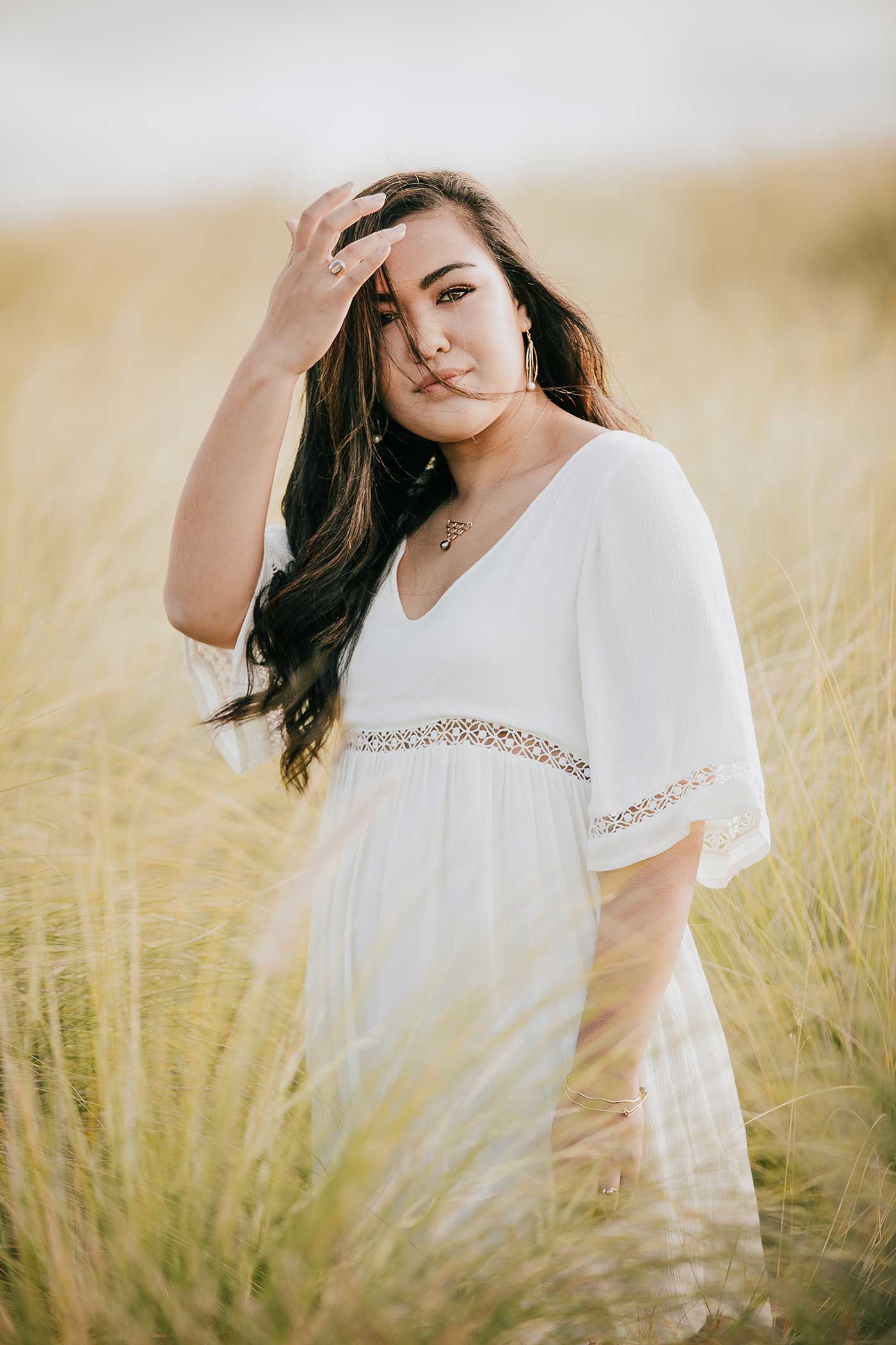 image of a senior portrait of a girl in a meadow