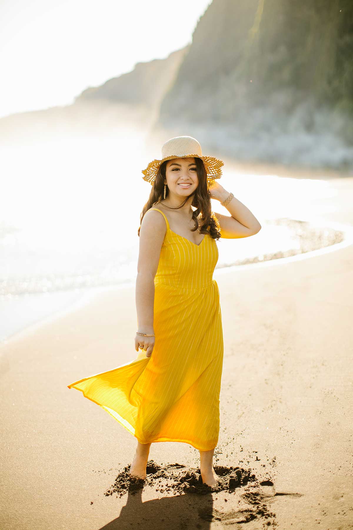 image of a senior portrait of a girl wearing a yellow dress