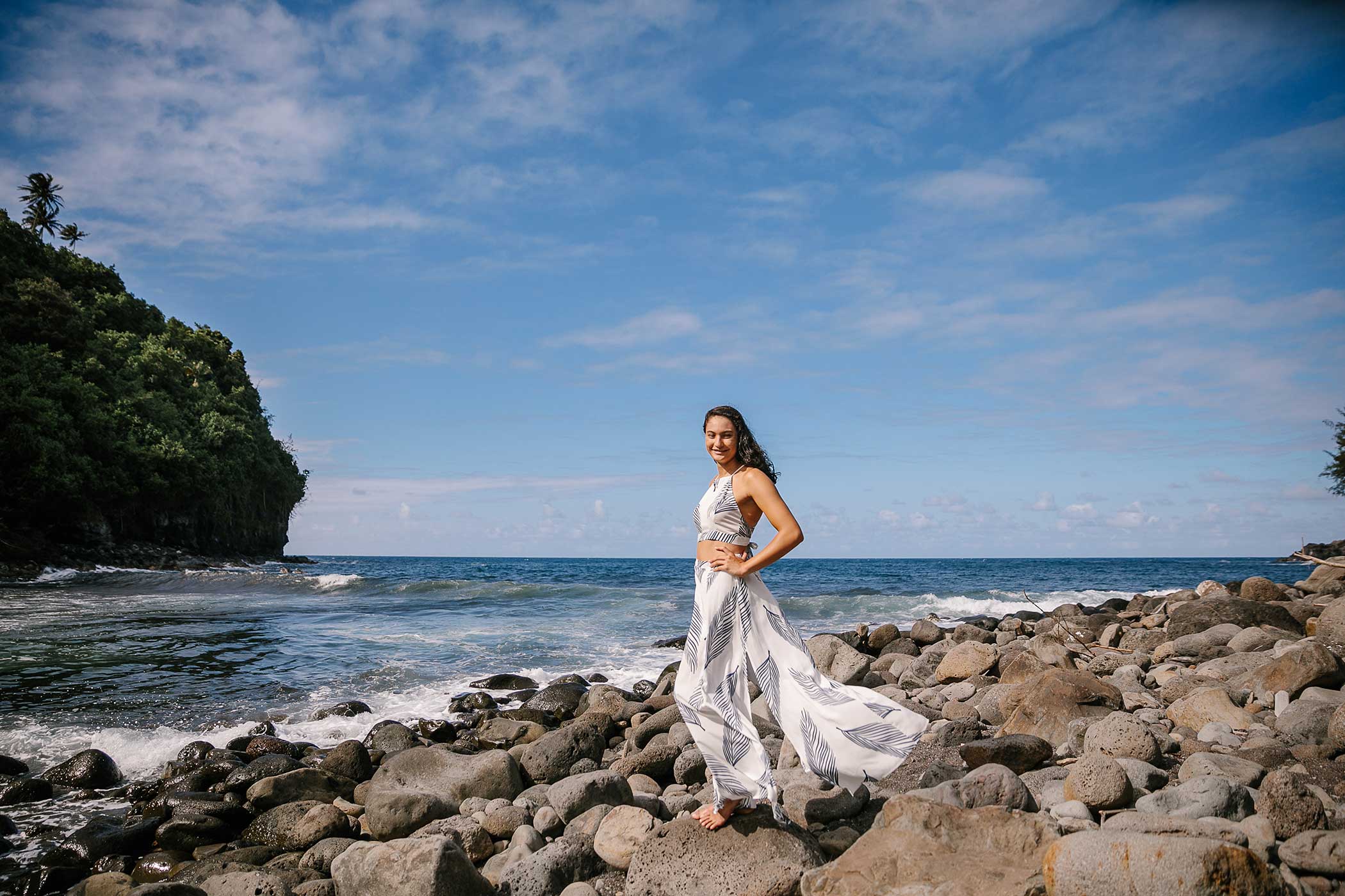 image of a senior portrait of a girl standing near the ocean