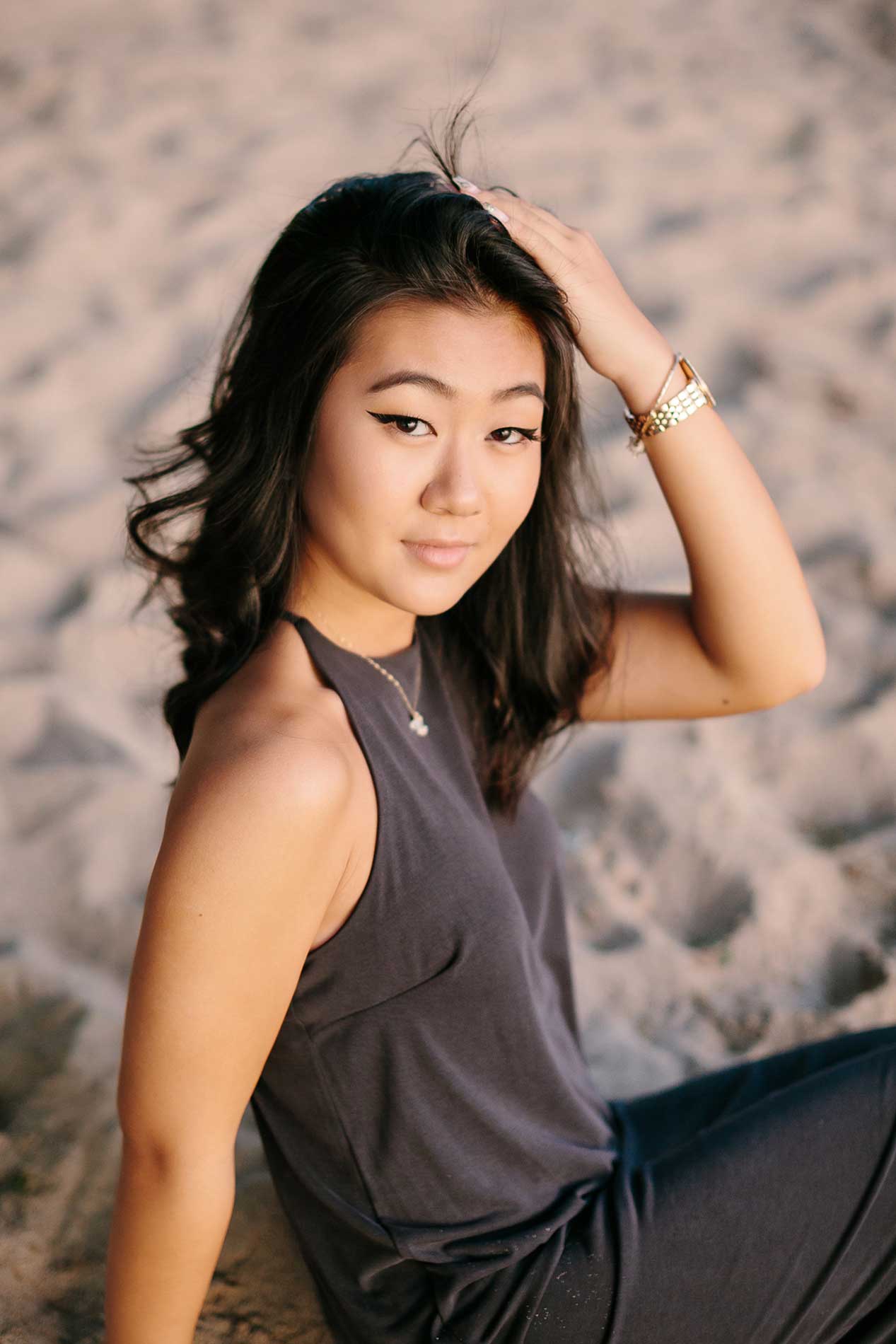 image of a senior portrait on the sand