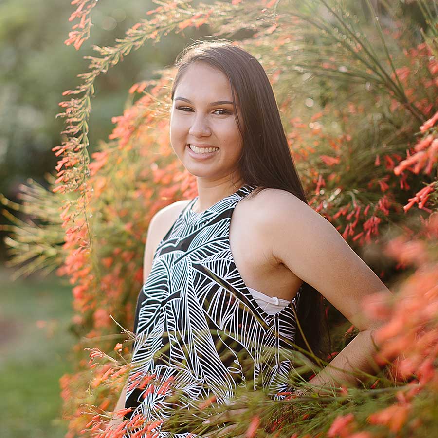 image of a senior portrait near flowers