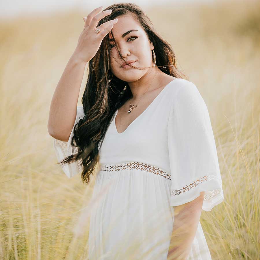 image of a senior portrait of a girl in a meadow