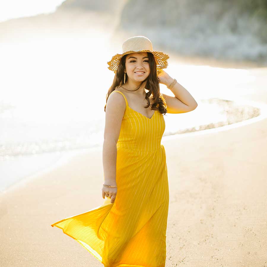 image of a senior portrait of a girl wearing a yellow dress