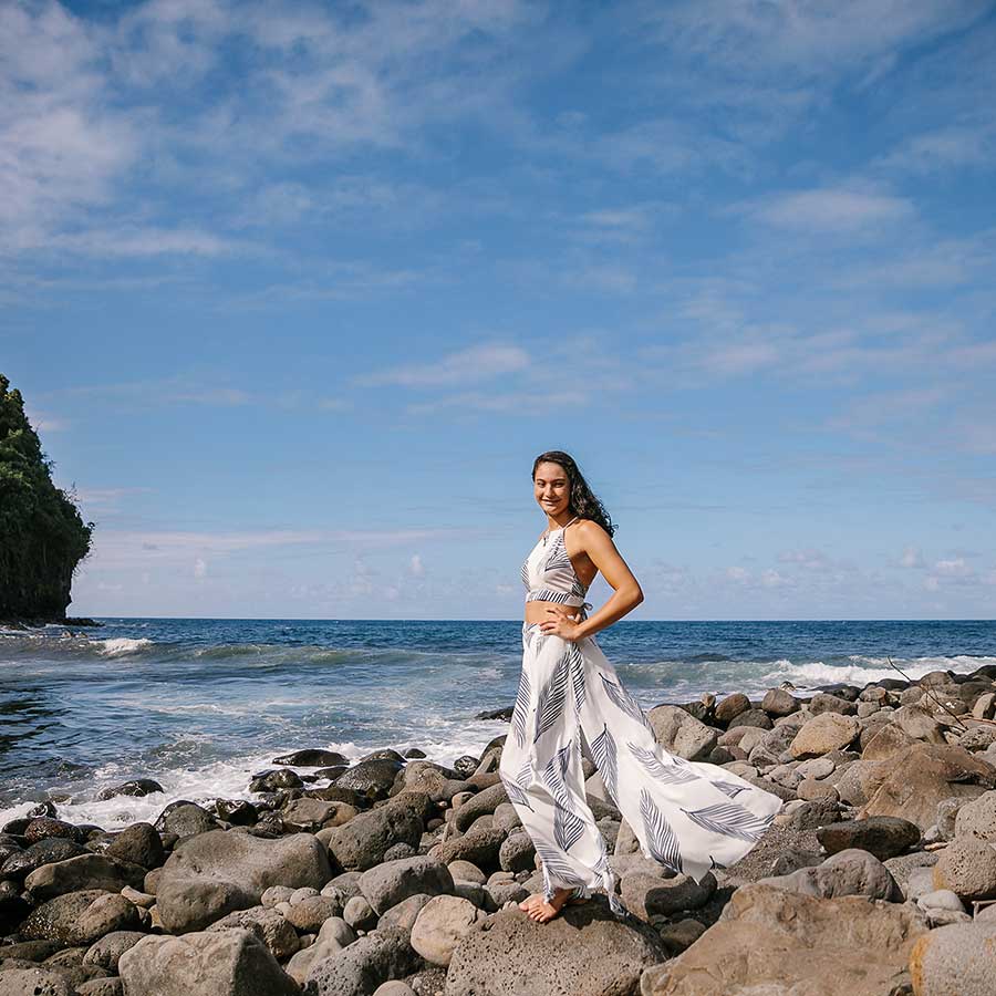 image of a senior portrait of a girl standing near the ocean