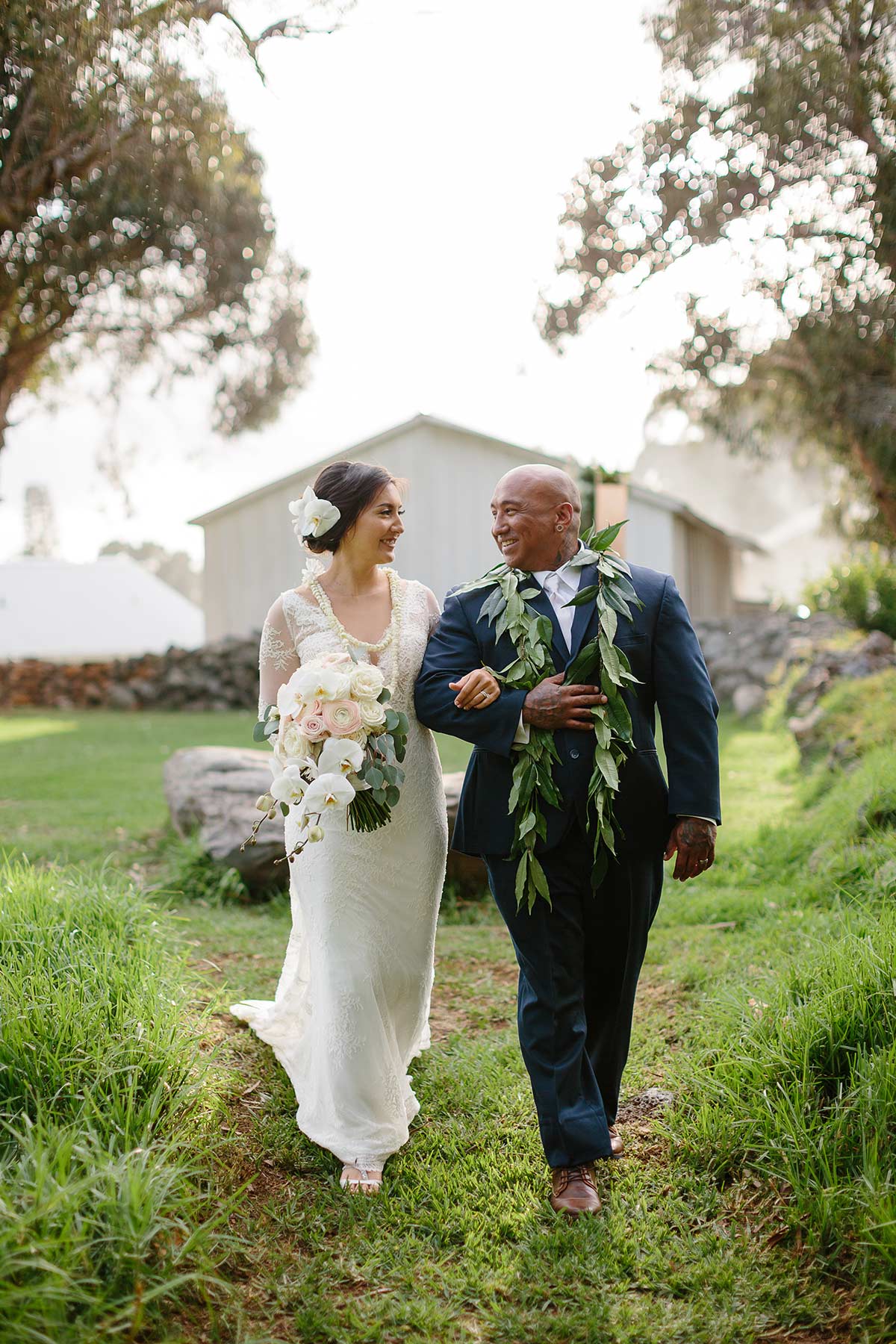 image of bridal couple walking at their ceremony